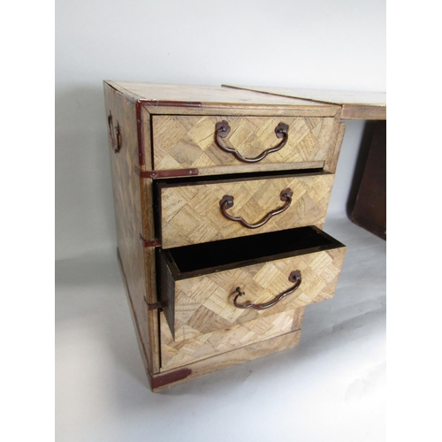 1630 - A Japanese parquetry table top cabinet, fitted with five small drawers and a hinged door enclosing t... 