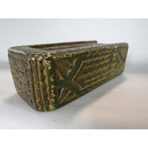 1634 - 18th century carved pine games or candle box, with naive carved panels, the slide top enclosing a co... 