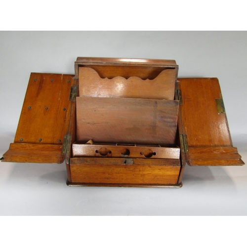 1635 - Early 20th century golden oak desk top box, the sloped top enclosing a waterfall interior and recess... 