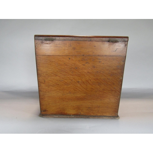 1635 - Early 20th century golden oak desk top box, the sloped top enclosing a waterfall interior and recess... 