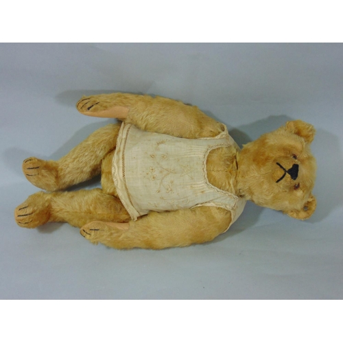 127 - Early 20th century teddy bear by Steiff with pin in ear, light brown fur, pronounced snout, stitched... 