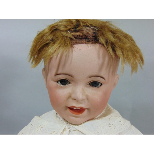 128 - Circa 1910 bisque head baby doll by SFBJ, a 'Laughing Jumeau', with 5 piece bent limb composition bo... 