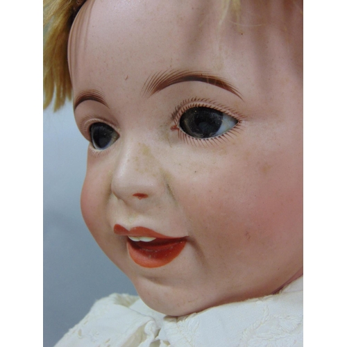 128 - Circa 1910 bisque head baby doll by SFBJ, a 'Laughing Jumeau', with 5 piece bent limb composition bo... 