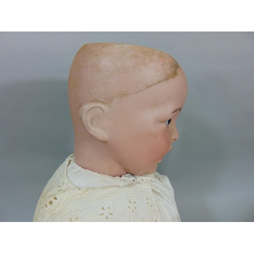 128 - Circa 1910 bisque head baby doll by SFBJ, a 'Laughing Jumeau', with 5 piece bent limb composition bo... 