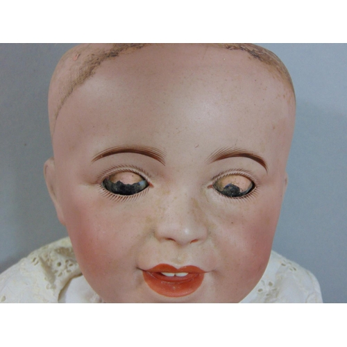 128 - Circa 1910 bisque head baby doll by SFBJ, a 'Laughing Jumeau', with 5 piece bent limb composition bo... 