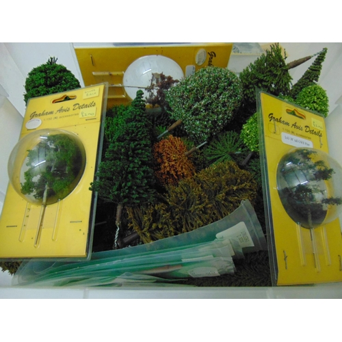 136 - Large collection of materials for creating model railway scenery including rolls of grass, bushes, t... 