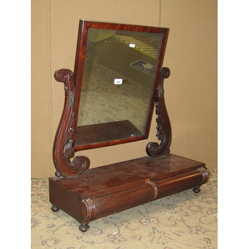 2348 - A 19th century mahogany toilet mirror with rectangular plate raised  on scrolled supports and platfo... 