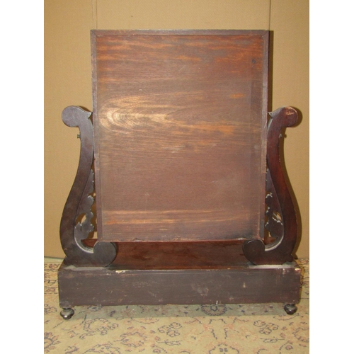 2348 - A 19th century mahogany toilet mirror with rectangular plate raised  on scrolled supports and platfo... 