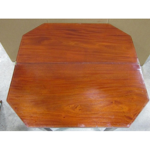 2350 - A Georgian mahogany foldover top breakfront tea table with inlaid detail, canted front corners and s... 