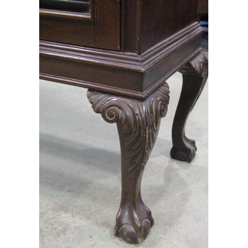 2354 - A Georgian revival side cabinet with dentil moulded cornice over a pair of rectangular astragal glaz... 