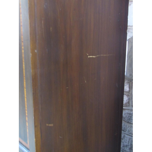 2356 - An inlaid Edwardian walnut wardrobe with satinwood crossbanding and moulded cornice over a central t... 