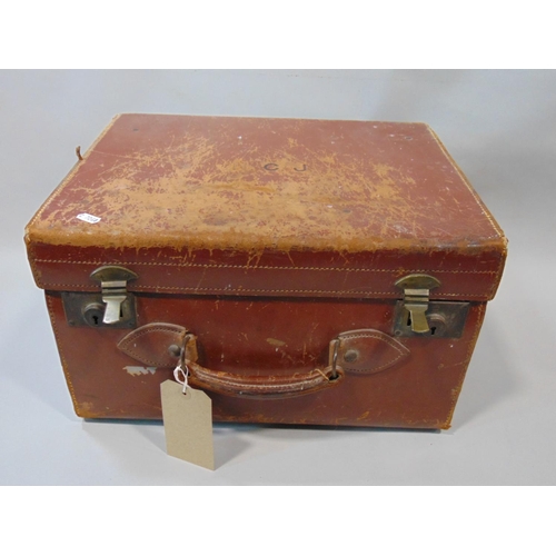 1556 - Leather travelling case fitted for carrying top hat and accessories, containing black silk top hat, ... 