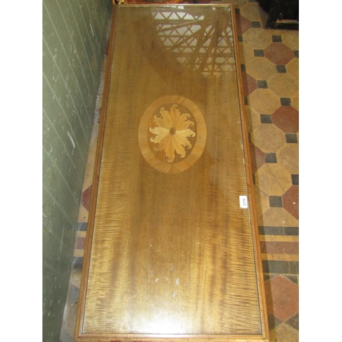 2375 - A reproduction occasional table of rectangular form with inlaid marquetry panel and inset plate glas... 