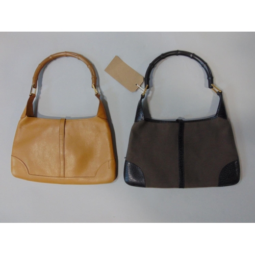 1565 - 2 Gucci hand bags, both in same style with single handle, zipped inner pocket, with minimal signs of... 