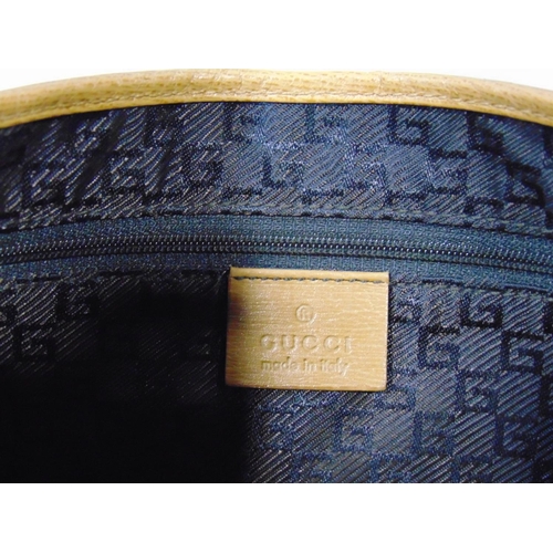 1565 - 2 Gucci hand bags, both in same style with single handle, zipped inner pocket, with minimal signs of... 