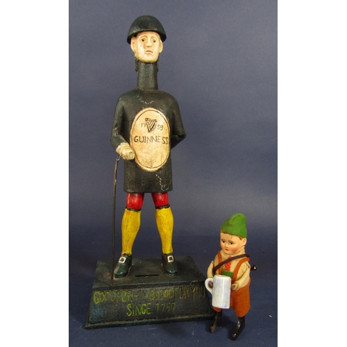 1906 - A cast iron figural money box for Guinness the base inscribed Good For Him and Good For You since 17... 