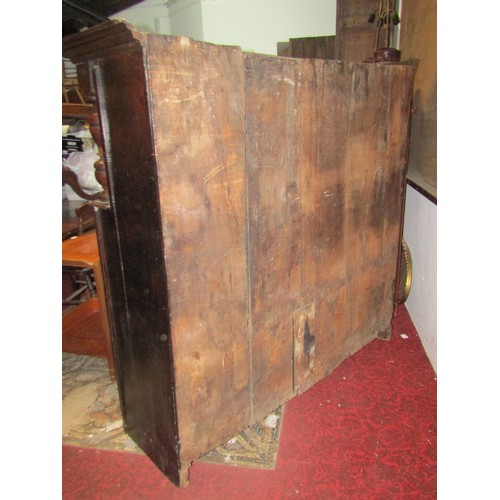 2423 - An 18th century oak court cupboard enclosed by an arrangement of four moulded rectangular panelled d... 