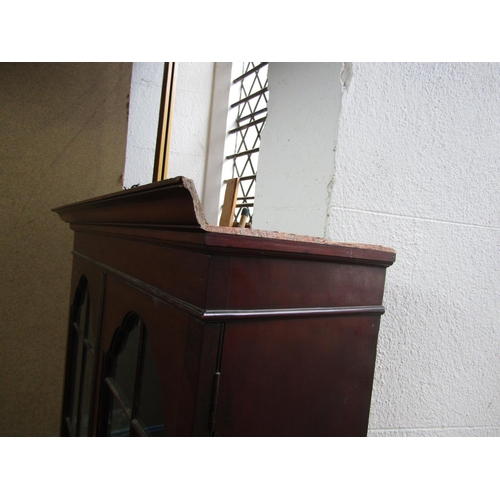 2163 - An Edwardian mahogany bureau bookcase, the upper section enclosed by a pair of moulded arched, glaze... 