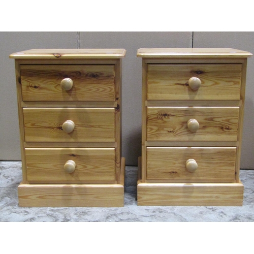 2166 - Pair of contemporary stripped pine three drawer bedside chests, together with a further pine cheval ... 