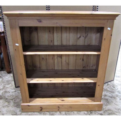 2188 - A contemporary stripped pine drawer freestanding open bookcase with two adjustable shelves, raised/s... 