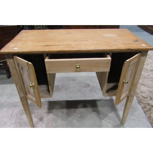 2200 - A rustic stripped pine kneehole side or dressing table fitted with a central frieze drawer flanked b... 