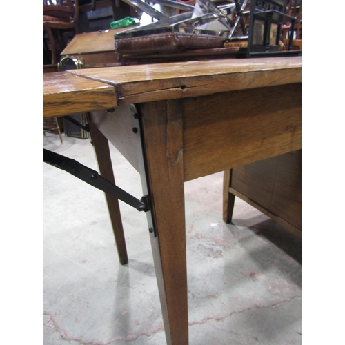 2202 - A vintage oak kneehole single pedestal desk, fitted with four long drawers and drop leaf, raised on ... 