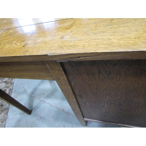 2202 - A vintage oak kneehole single pedestal desk, fitted with four long drawers and drop leaf, raised on ... 