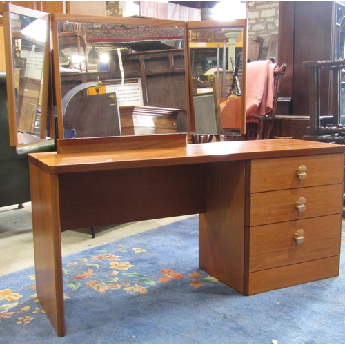 2205 - A Stag teak bedroom pair comprising kneehole single pedestal dressing table, fitted with three long ... 