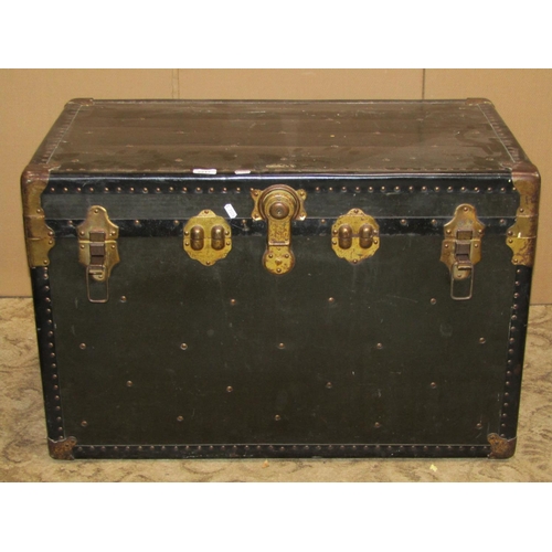 2217 - A vintage American cabin trunk with reinforced studded corners, metal fittings and stitched leather ... 