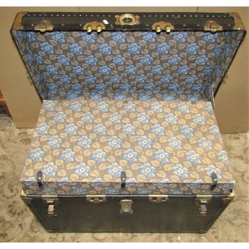 2217 - A vintage American cabin trunk with reinforced studded corners, metal fittings and stitched leather ... 