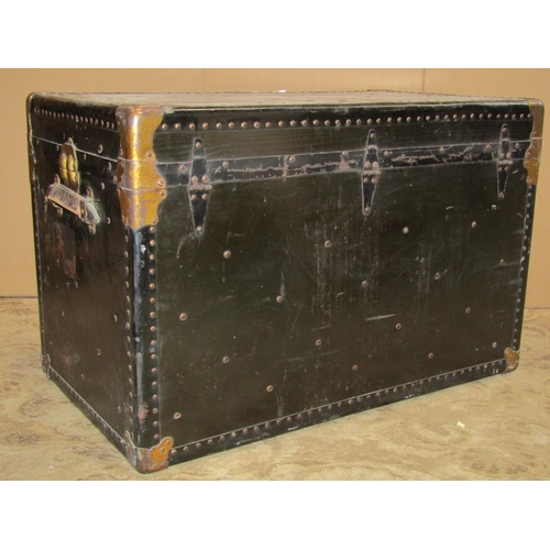 2217 - A vintage American cabin trunk with reinforced studded corners, metal fittings and stitched leather ... 