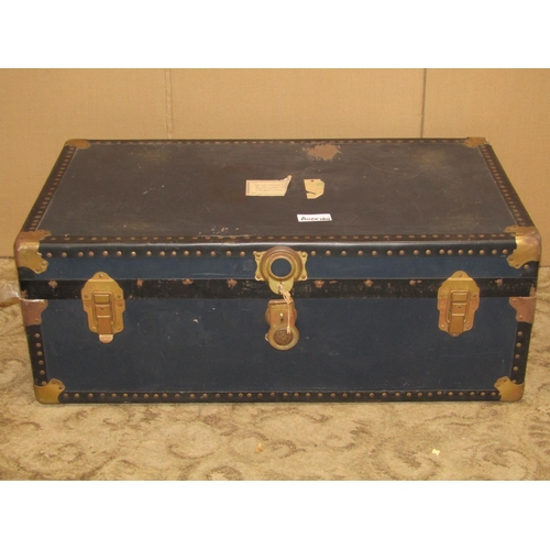 2217 - A vintage American cabin trunk with reinforced studded corners, metal fittings and stitched leather ... 