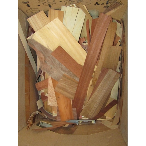 2224 - A large quantity of off cuts/strips of mixed wood veneers, ideal for crafting, marquetry and furnitu... 