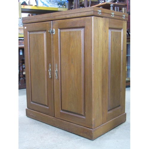 2225 - A contemporary hardwood drinks cabinet and combined bar with panelled frame, foldover top and enclos... 