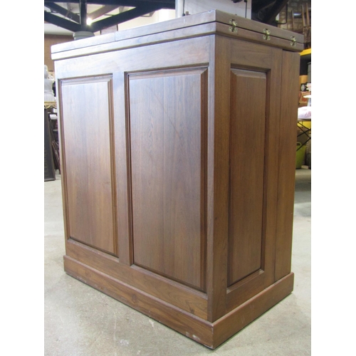 2225 - A contemporary hardwood drinks cabinet and combined bar with panelled frame, foldover top and enclos... 