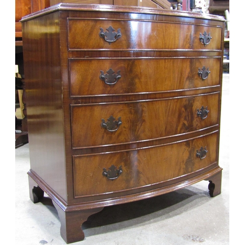 2227 - A reproduction Georgian style mahogany bow fronted chest of four long graduated drawers with well ma... 