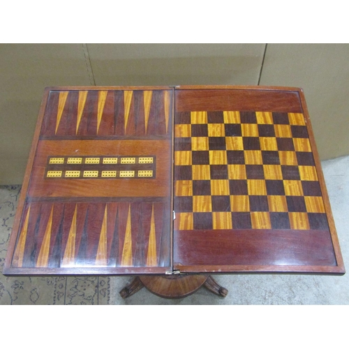 2242 - A 19th century mahogany foldover top games table, with inlaid chequered backgammon and cribbage scor... 