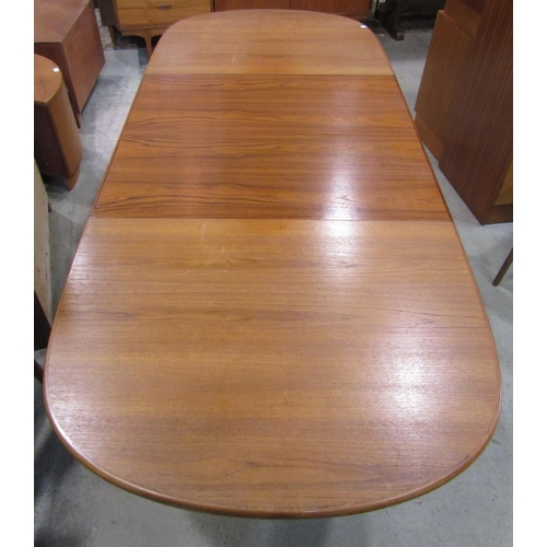 2260 - A Danish teak D end pull out extending dining table with moulded outline and single additional leaf ... 