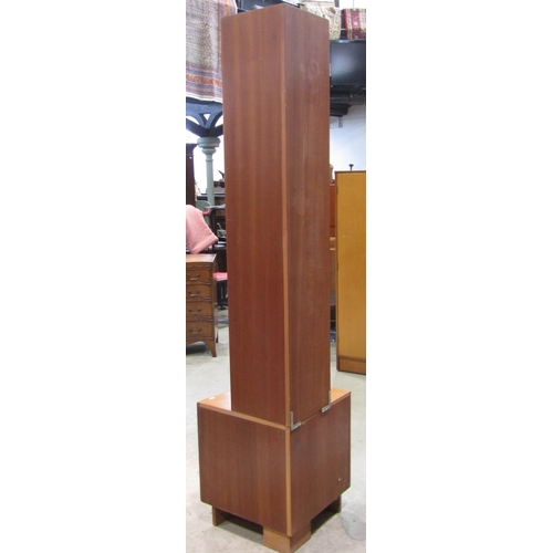 2270 - A G plan teak floorstanding bow fronted corner unit, the base enclosed by a pair of doors with sculp... 