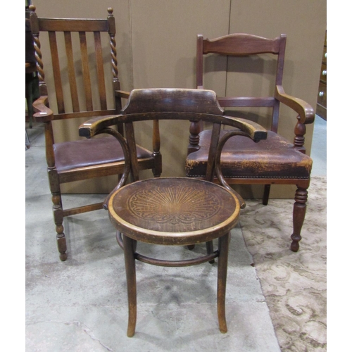 2280 - A late Victorian mahogany open elbow chair with moulded bar back over a worn leather upholstered sea... 