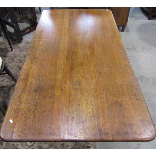 2285 - An oak refectory table, the rectangular top with moulded outline and rounded corners raised on shape... 