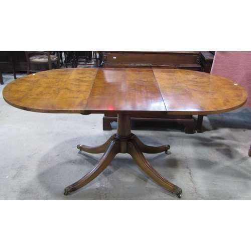 2288 - A good quality Regency style yew wood veneered D end extending dining table with single additional l... 