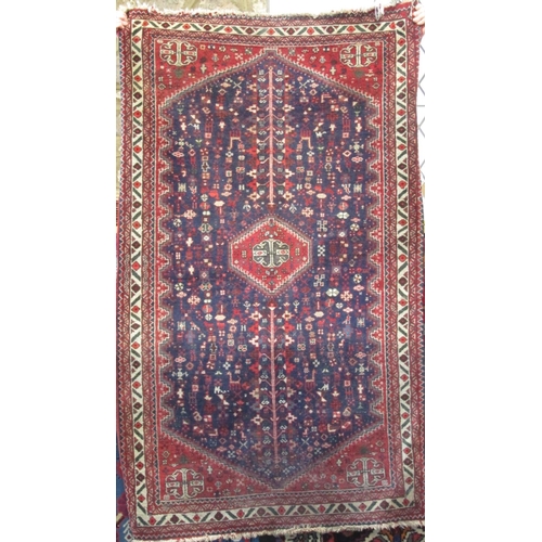 2470 - A good tight weave Afghan type rug with various still life's of animals and foliage upon a blue and ... 