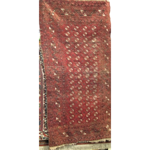 2474 - Antique Bokhara rug with small geometric medallion decoration upon a deep red ground, 200 x 140 cm (... 