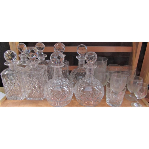 1186 - A large collection of possibly Waterford crystal glassware comprising three baluster decanters, five... 