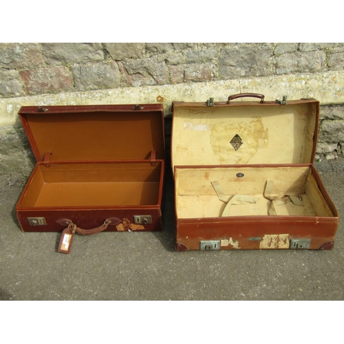 2323 - A vintage Revelation tan coloured vulcanized fibre suitcase with stitched leather handle and metal f... 