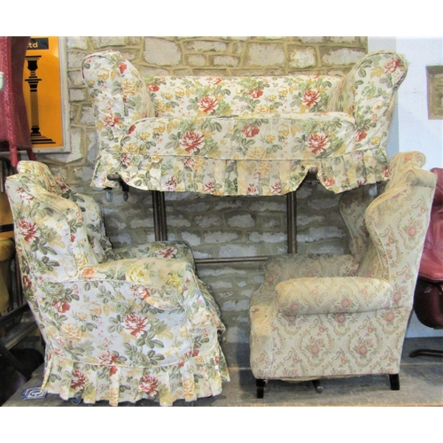 2322 - An Edwardian/1920s two tier two seat Chesterfield sofa with floral patterned upholstery together wit... 