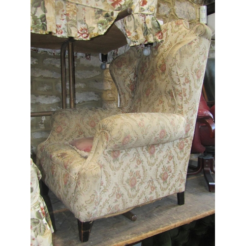 2322 - An Edwardian/1920s two tier two seat Chesterfield sofa with floral patterned upholstery together wit... 