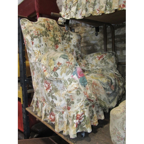 2322 - An Edwardian/1920s two tier two seat Chesterfield sofa with floral patterned upholstery together wit... 