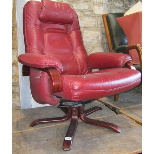 2324 - A contemporary Stressless style swivel lounge chair with soft stitched red leather upholstered seat,... 